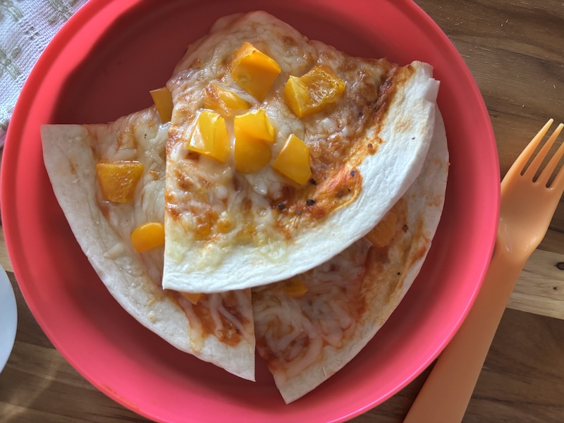 A picture of the tortilla pizza cooked for 3 minutes in the air fryer