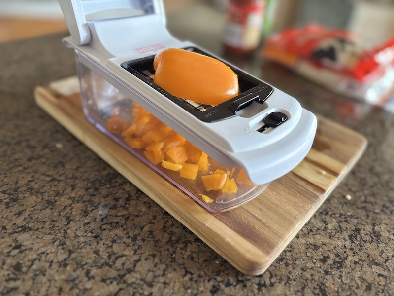 Fullstar vegetable chopper cutting a bell pepper