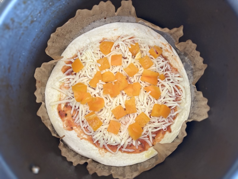 Step 4 of making the tortilla pizza is to place it in the air fryer