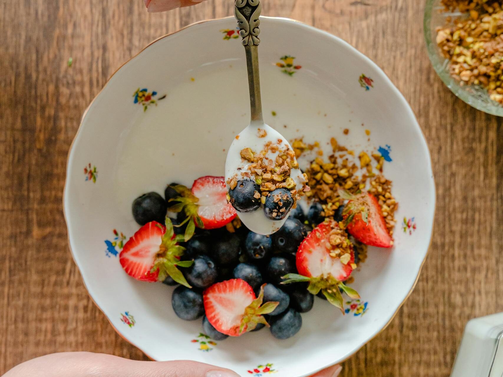 A fresh and delicious berry breakfast with granola and yogurt.