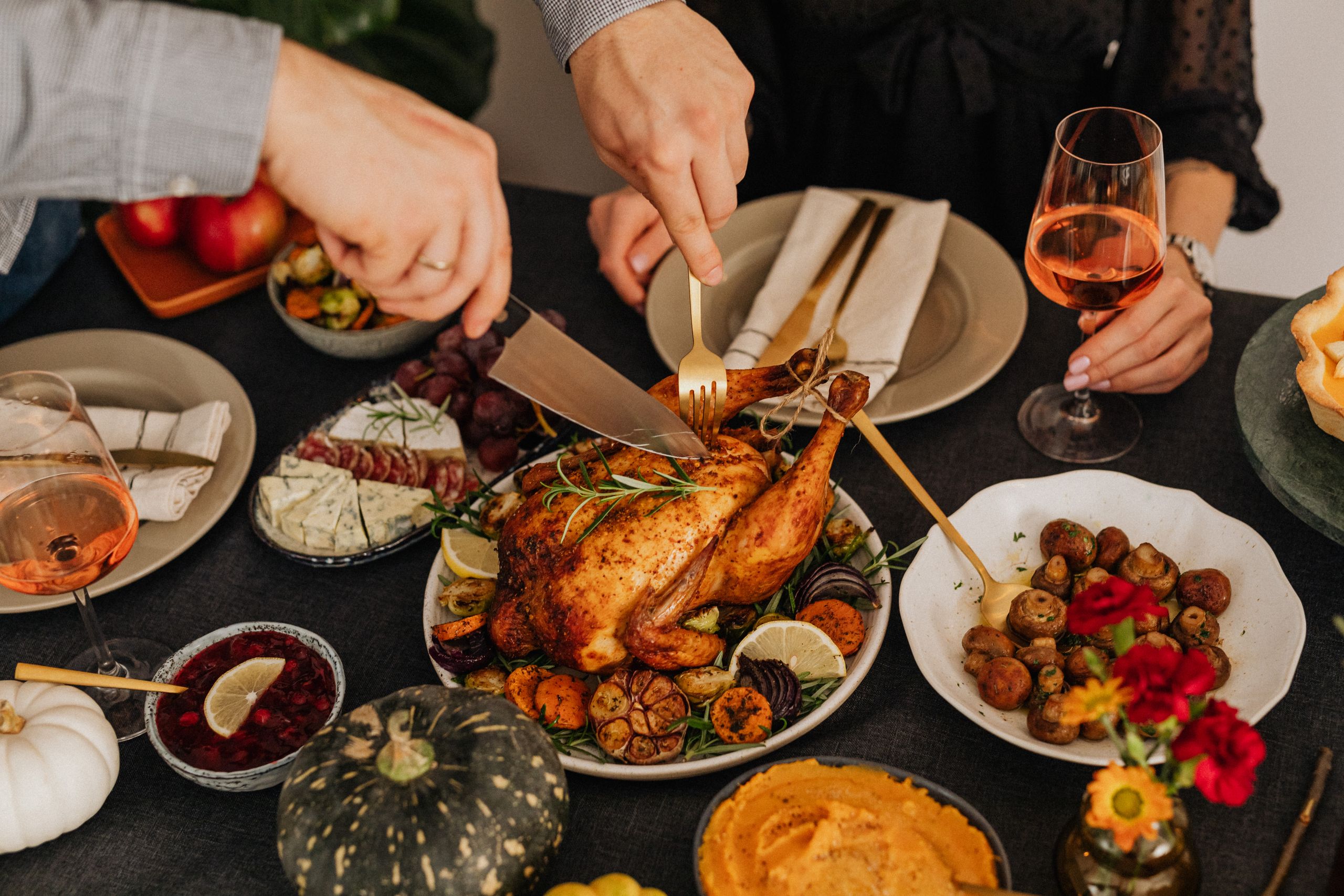 A delicious Thanksgiving dinner featuring roasted chicken and various side dishes.